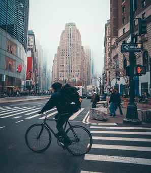 a man rides bike in the city