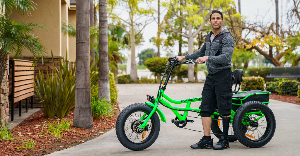 man riding a green e-bike